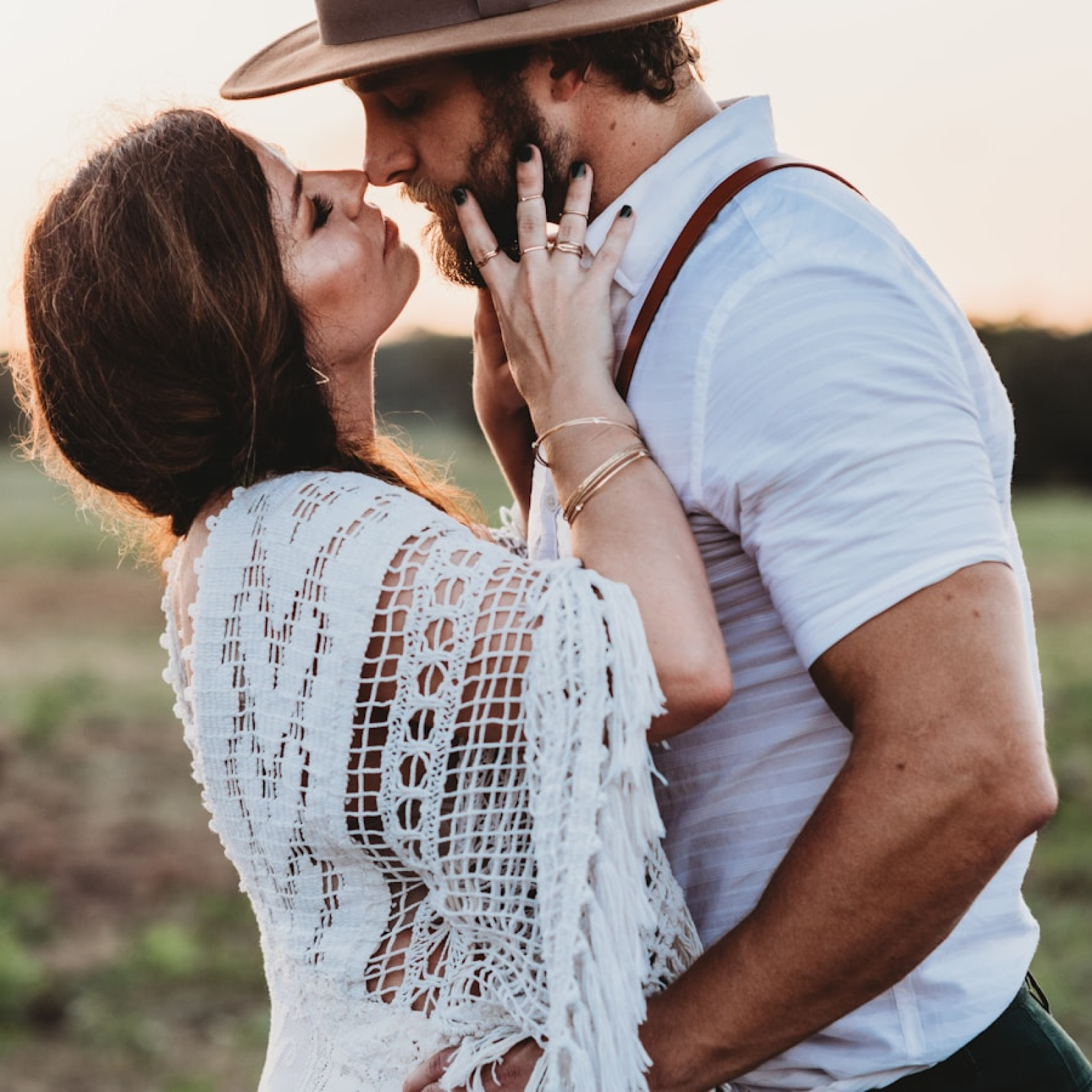 A couple embracing in golden evening light outside Austin
